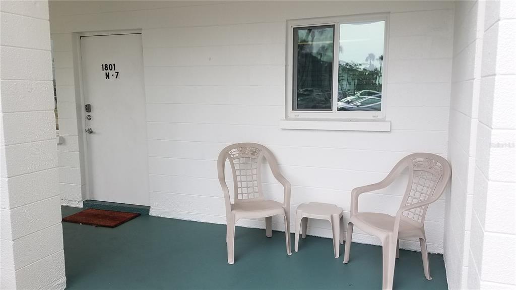 1801 Restful Drive, Unit N7 Bradenton, FL 34207 - Photo 2 of 24 a couple of chairs sitting next to a window