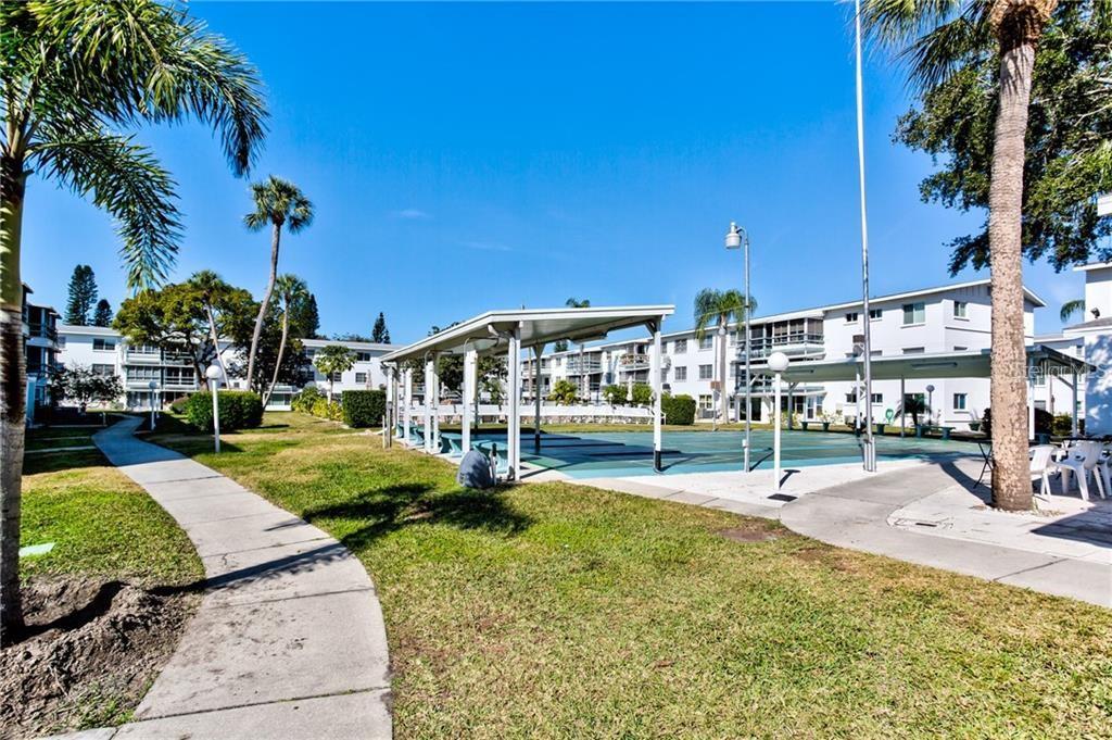 1801 Restful Drive, Unit N7 Bradenton, FL 34207 - Photo 23 of 24 a view of a swimming pool with a patio