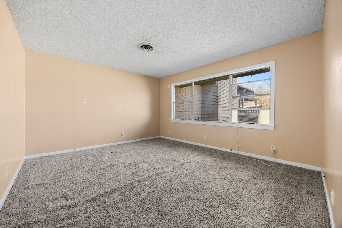 13038 4th Street Santa Fe, TX 77510 - Photo 15 of 39 a view of an empty room with a window
