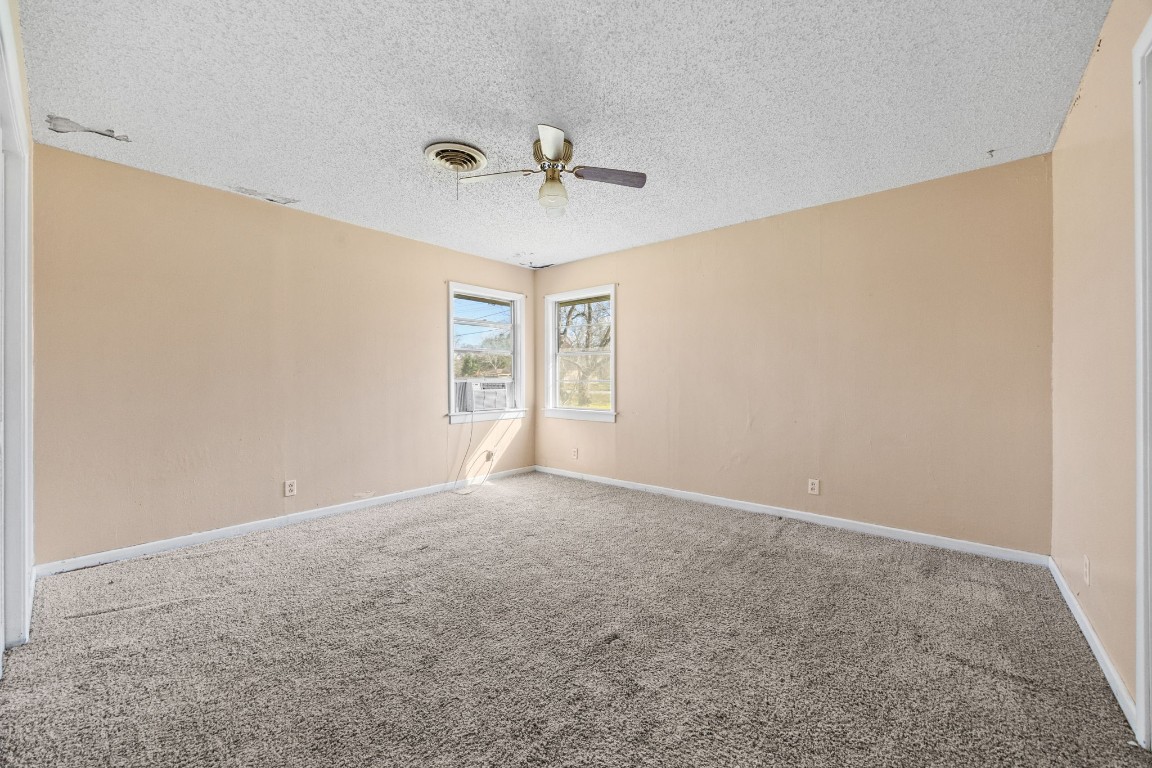 13038 4th Street Santa Fe, TX 77510 - Photo 17 of 39 a view of an empty room with a window