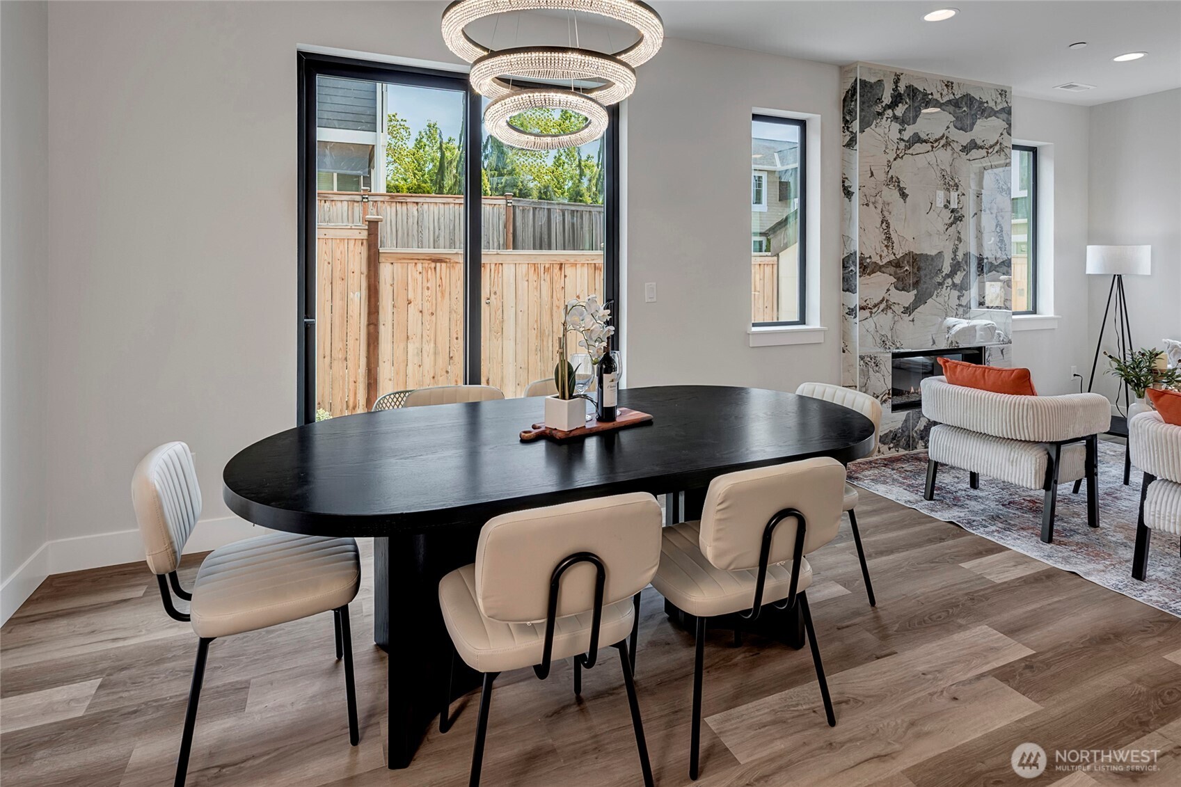 3926 214th Place Southeast, Unit B Bothell, WA 98021 - Photo 12 of 30 a view of a dining room with furniture window and wooden floor