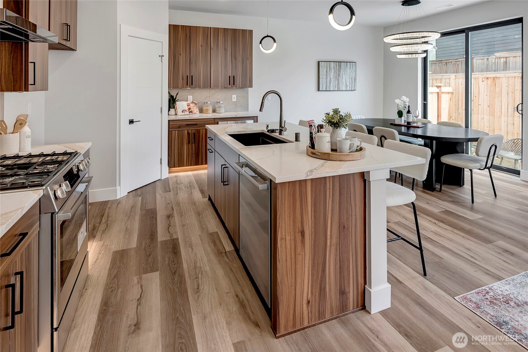 3926 214th Place Southeast, Unit B Bothell, WA 98021 - Photo 20 of 30 a kitchen with sink a stove and chairs