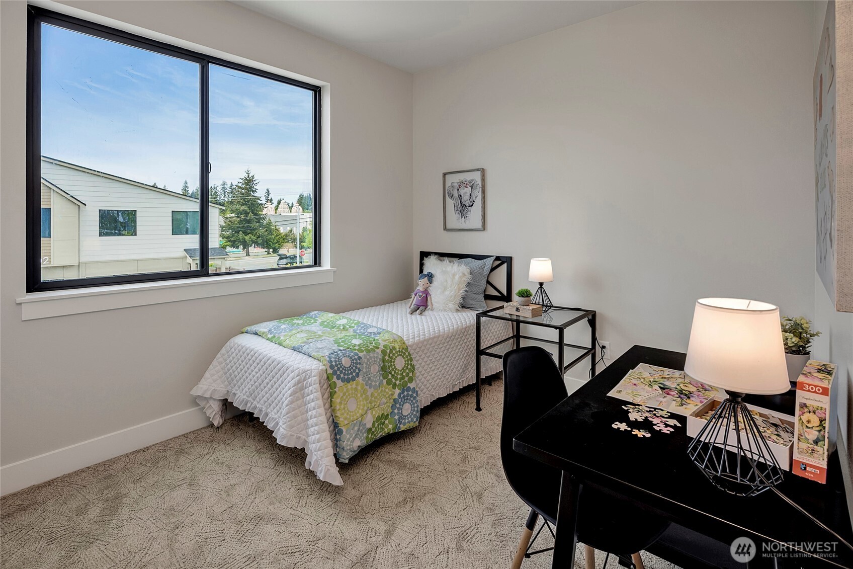 3926 214th Place Southeast, Unit B Bothell, WA 98021 - Photo 24 of 30 a bedroom with a bed window and lamp