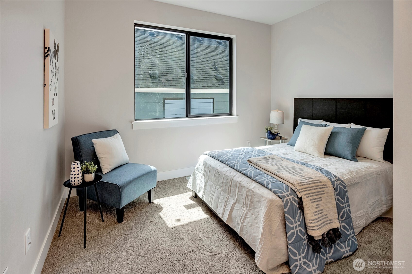 3926 214th Place Southeast, Unit B Bothell, WA 98021 - Photo 25 of 30 a bedroom with a bed chair and window