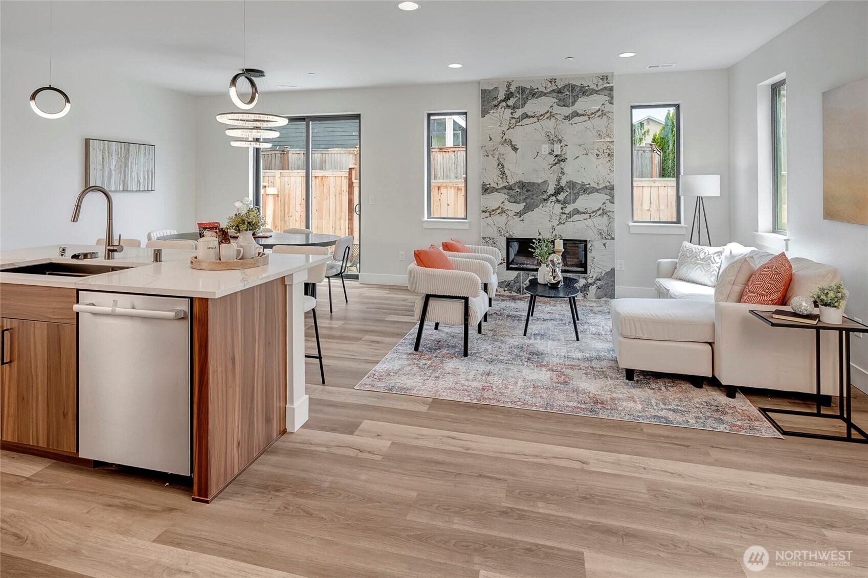 3926 214th Place Southeast, Unit B Bothell, WA 98021 - Photo 4 of 30 a living room with furniture a large window and a chandelier