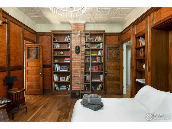 a view of empty room with wooden floor and outdoor view