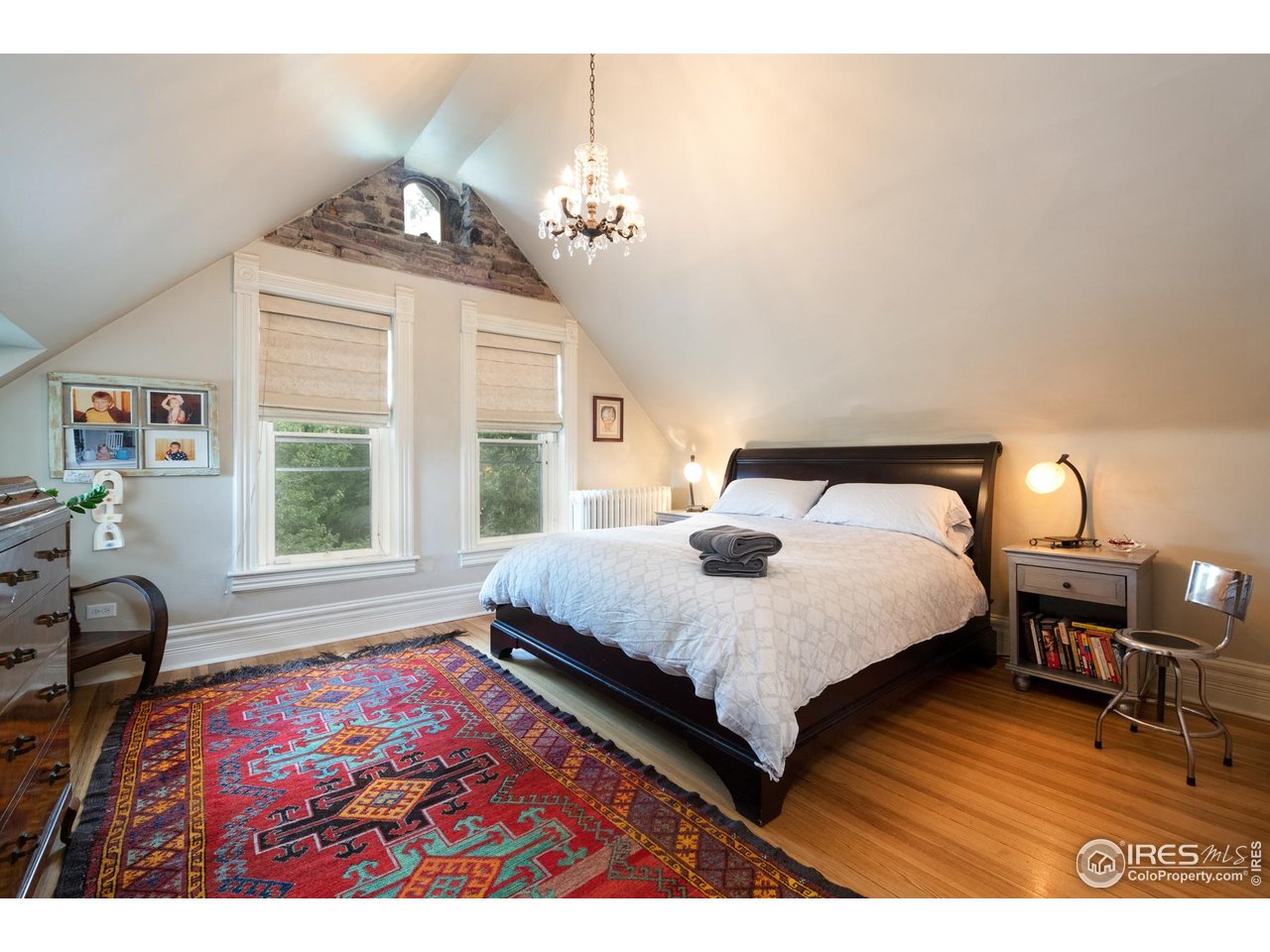 643 Mapleton Avenue Boulder, CO 80304 - Photo 25 of 50 a bedroom with a bed lamps and a large mirror