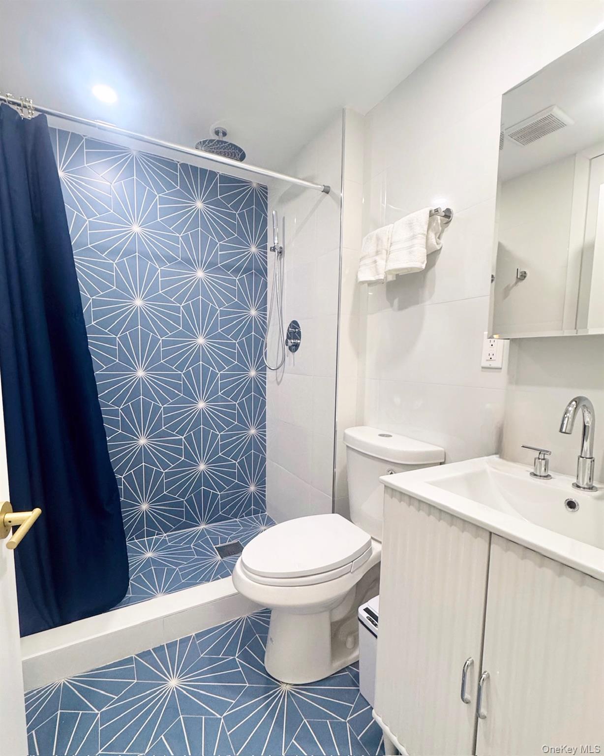 67 West Shore Road Kauneonga Lake, NY 12749 - Photo 12 of 17 Bathroom with toilet, a shower stall, vanity, and tile patterned floors