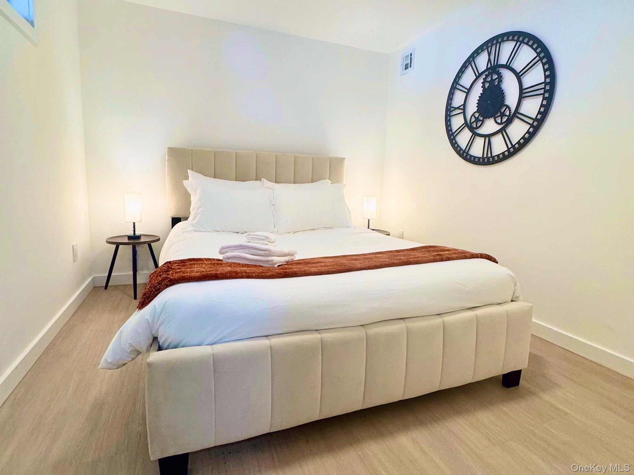 67 West Shore Road Kauneonga Lake, NY 12749 - Photo 13 of 17 Bedroom with baseboards and light wood-style floors