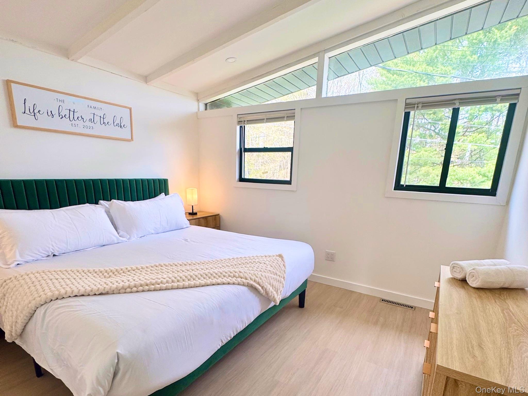 67 West Shore Road Kauneonga Lake, NY 12749 - Photo 5 of 17 Bedroom featuring light wood-style floors and baseboards