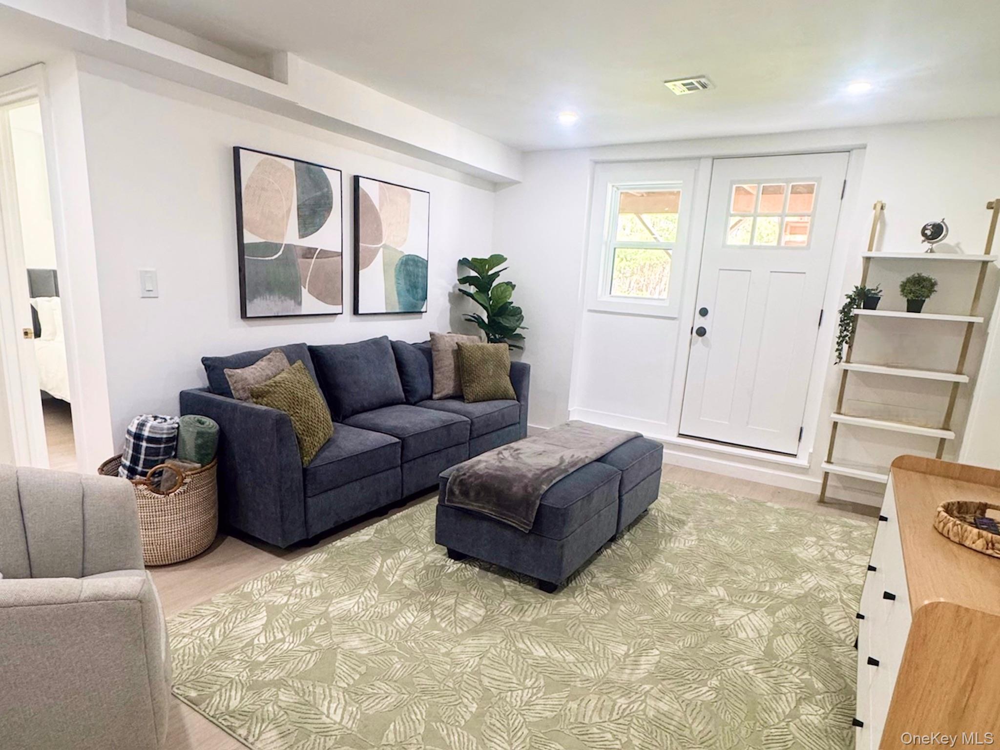 67 West Shore Road Kauneonga Lake, NY 12749 - Photo 8 of 17 Living area with light wood-type flooring and recessed lighting