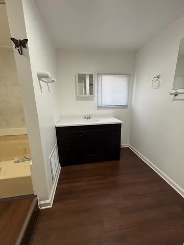 a bathroom with a sink and a bathtub