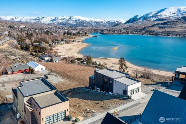 an aerial view of a house with a ocean view