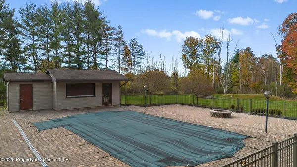 a view of house with yard and green space