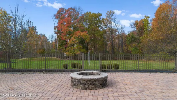a view of a backyard with sitting area