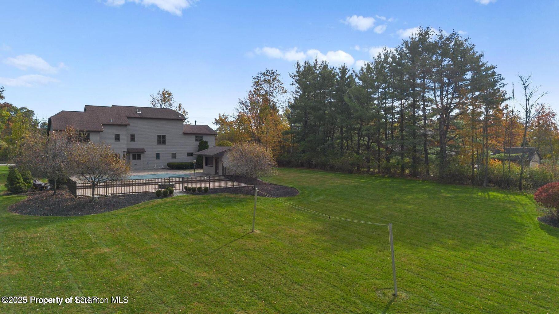 1266 Ryman Road Dallas, PA 18612 - Photo 14 of 73 a view of a house with a yard porch and sitting area