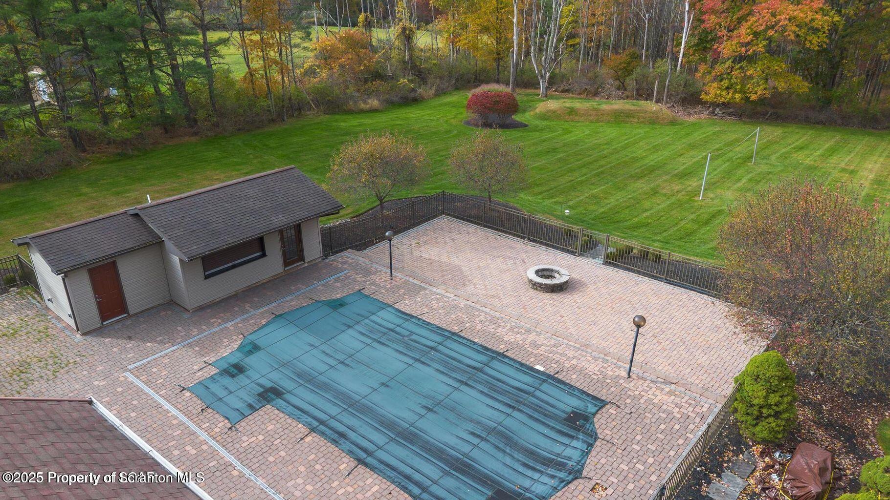 1266 Ryman Road Dallas, PA 18612 - Photo 16 of 73 a view of a backyard with sitting area