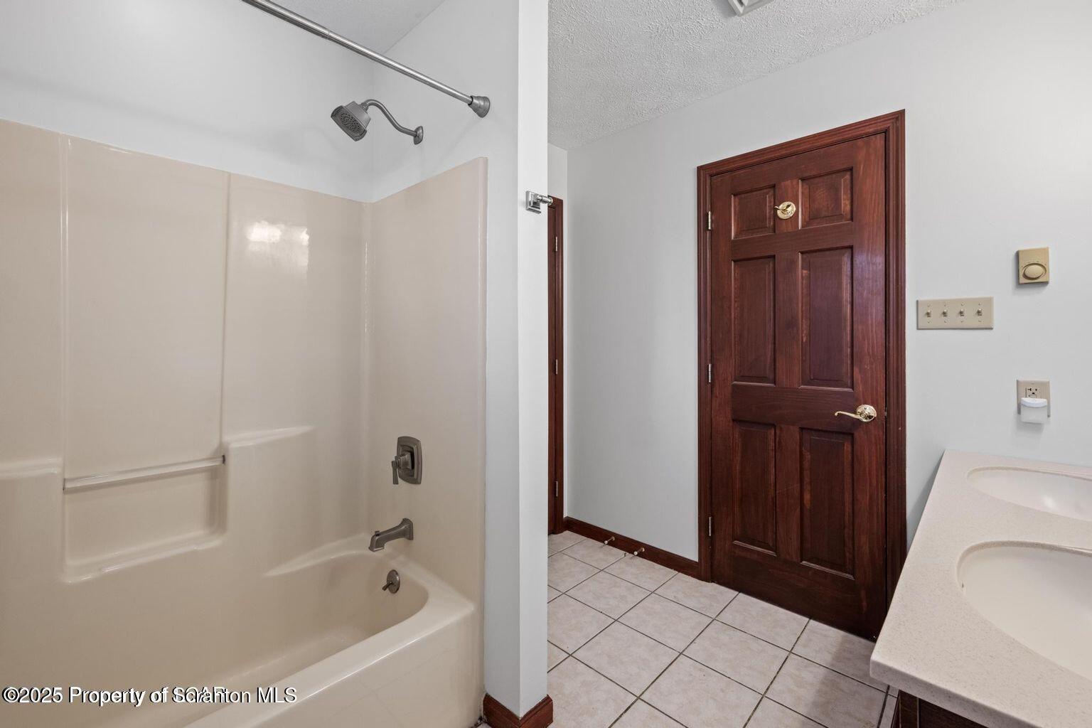 1266 Ryman Road Dallas, PA 18612 - Photo 23 of 73 a bathroom with a bathtub a toilet and a shower