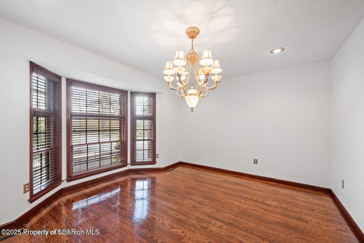 1266 Ryman Road Dallas, PA 18612 - Photo 38 of 73 a view of an empty room with wooden floor and a window