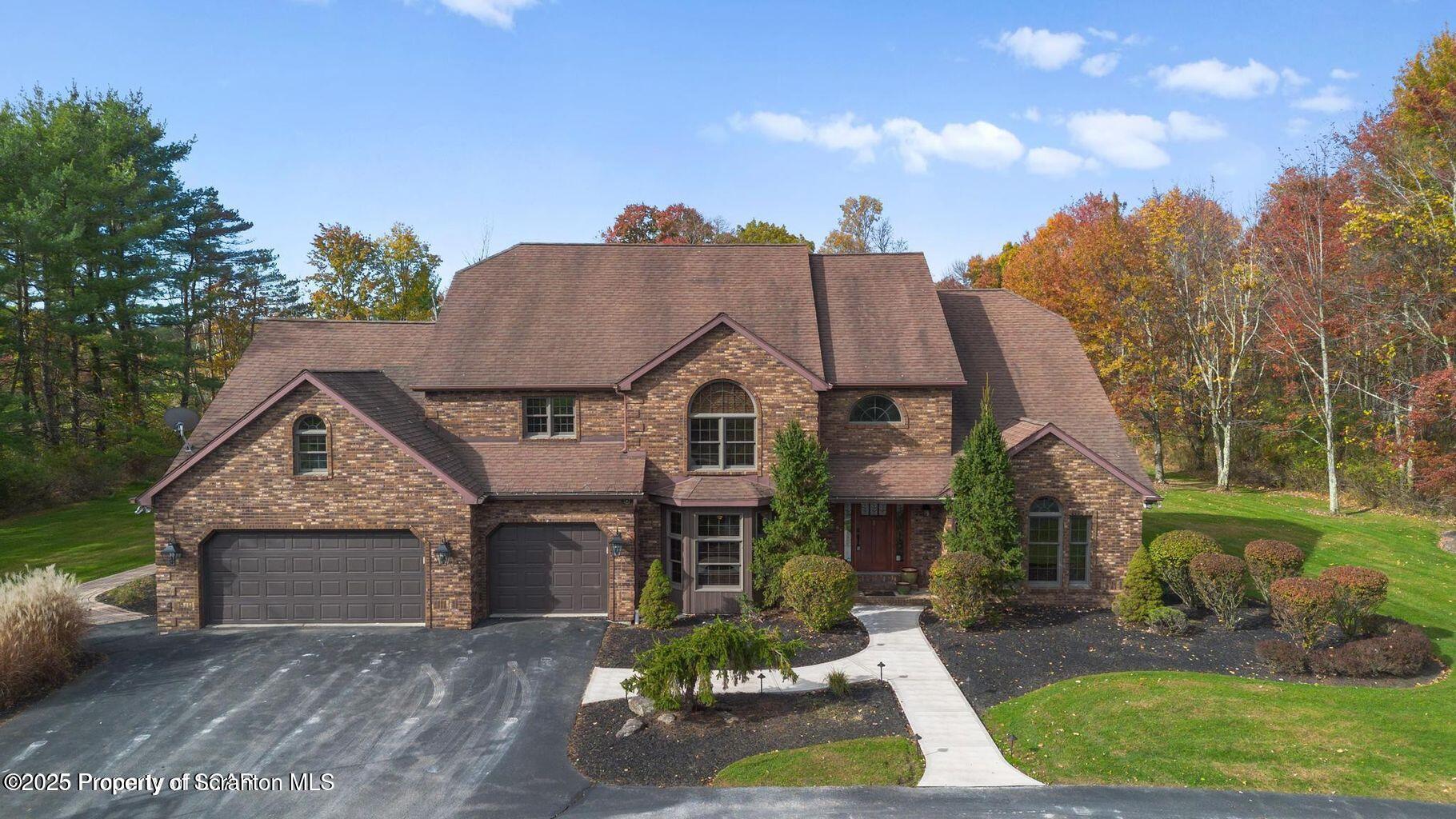 1266 Ryman Road Dallas, PA 18612 - Photo 5 of 73 a front view of house with yard and green space