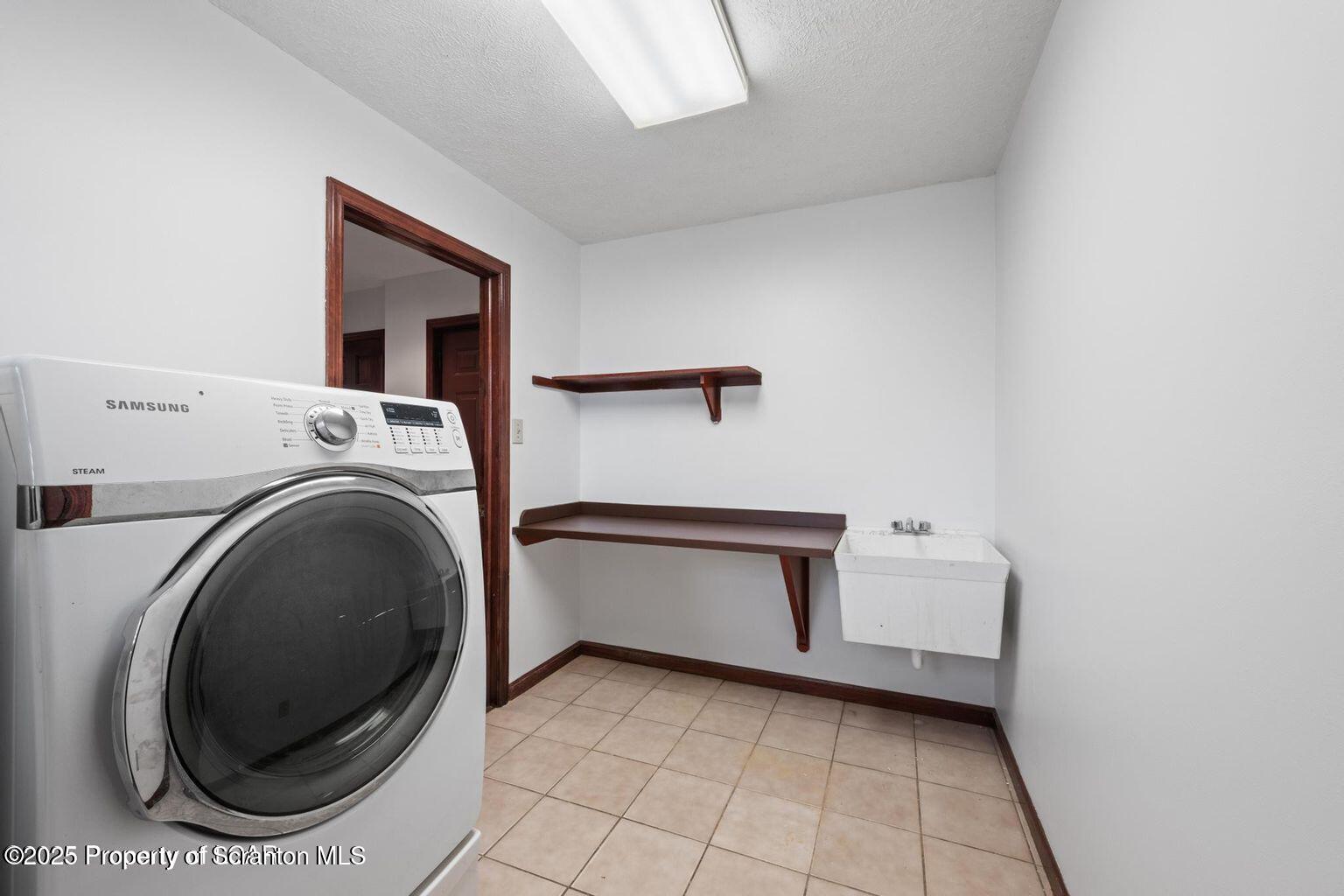 1266 Ryman Road Dallas, PA 18612 - Photo 55 of 73 a utility room with dryer and washer