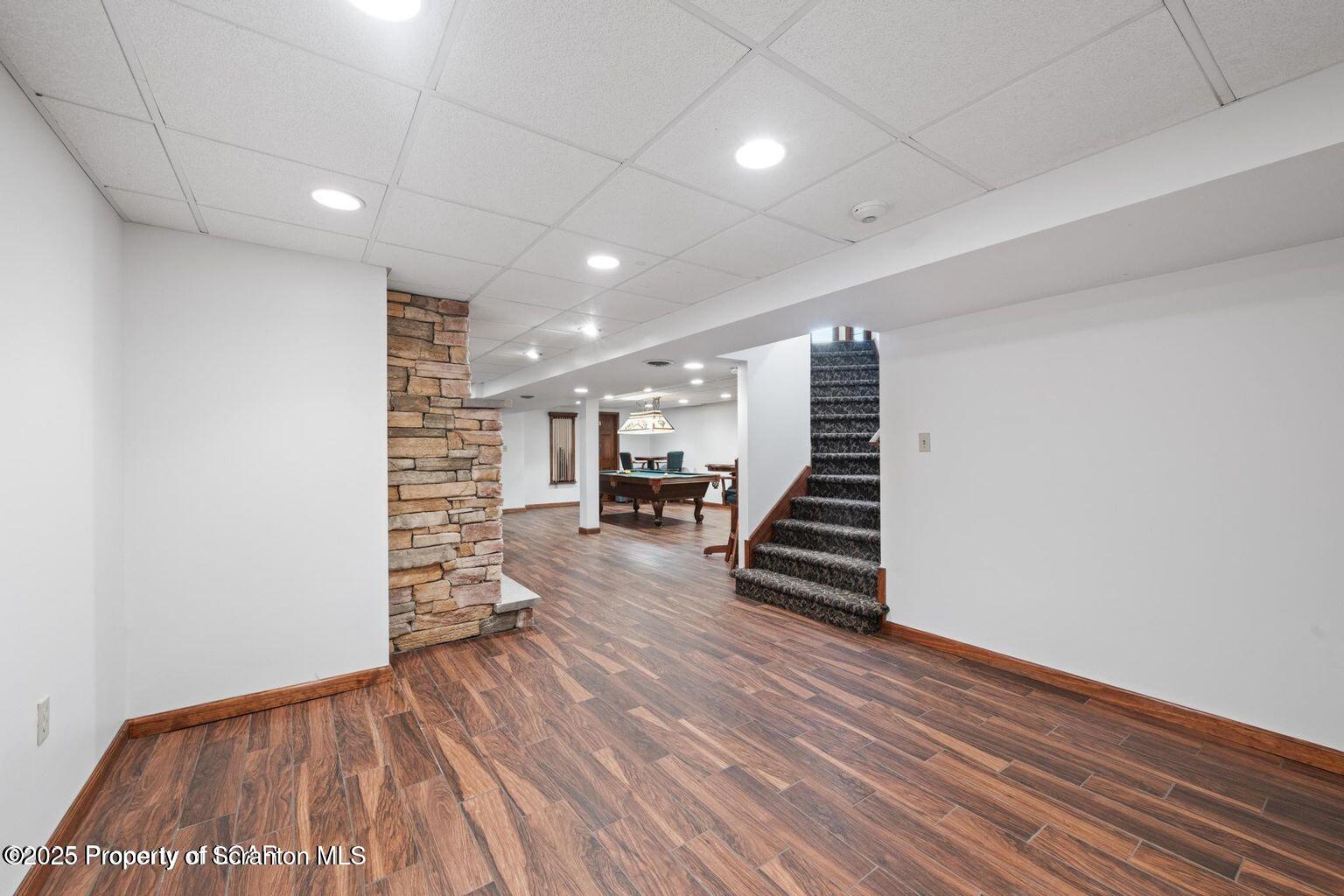 1266 Ryman Road Dallas, PA 18612 - Photo 59 of 73 a view of a room with stairs and wooden floor