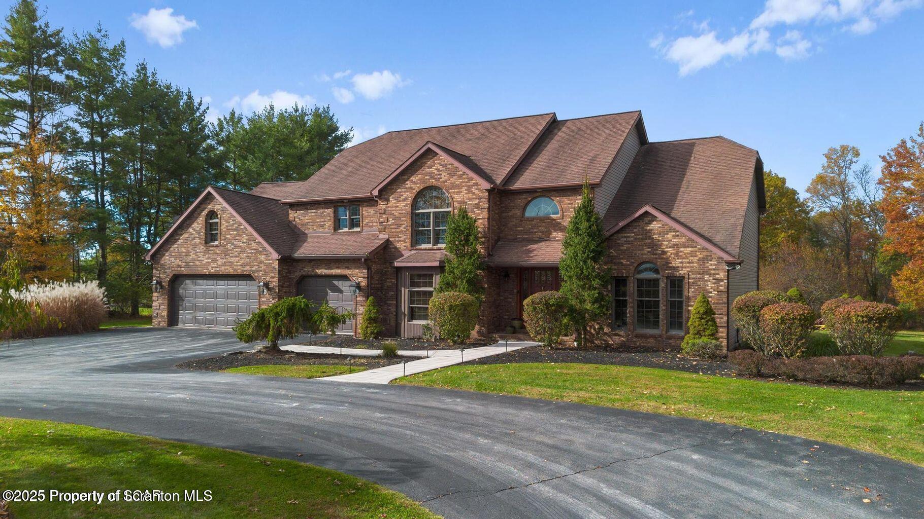 1266 Ryman Road Dallas, PA 18612 - Photo 6 of 73 a view of a house with a swimming pool and a yard