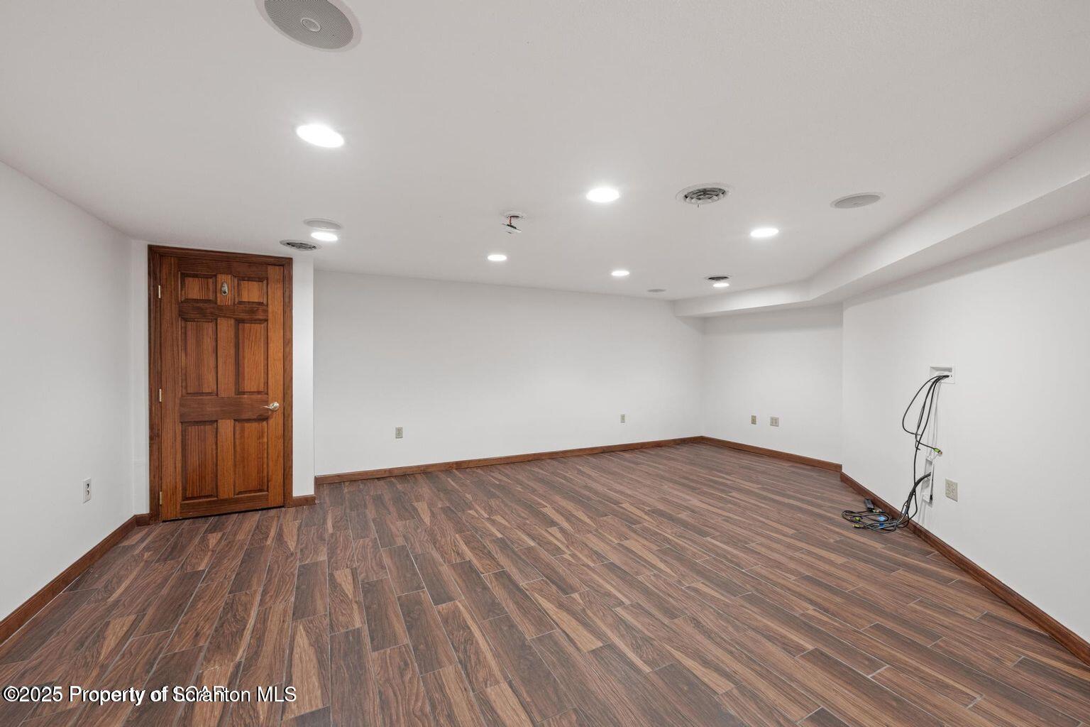 1266 Ryman Road Dallas, PA 18612 - Photo 66 of 73 a view of an empty room with wooden floor and a window