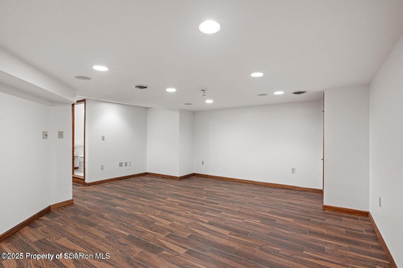 1266 Ryman Road Dallas, PA 18612 - Photo 67 of 73 a view of an empty room with wooden floor