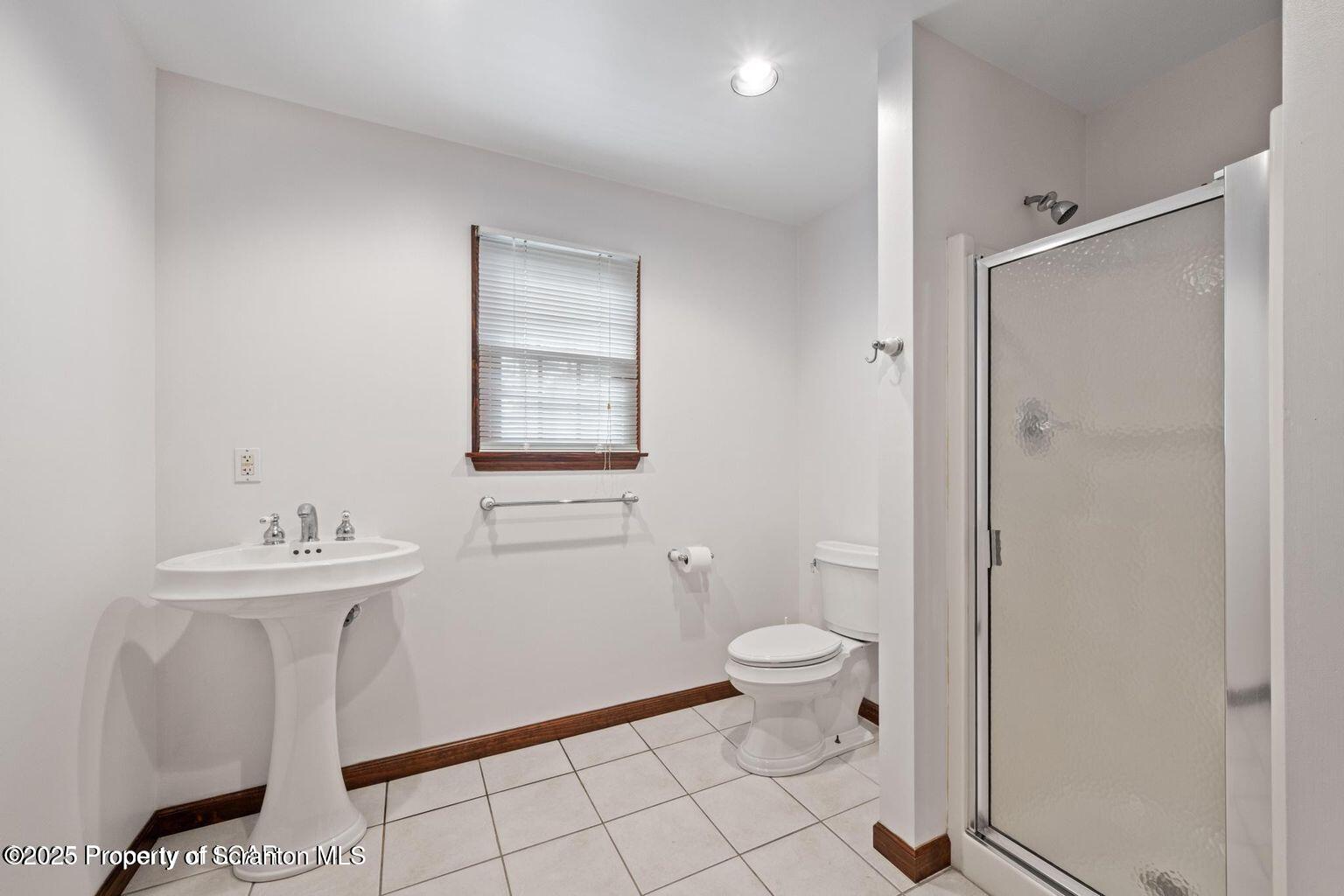 1266 Ryman Road Dallas, PA 18612 - Photo 71 of 73 a bathroom with a sink toilet and a mirror