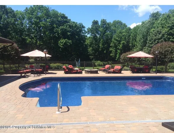 a view of a house with a yard porch and sitting area