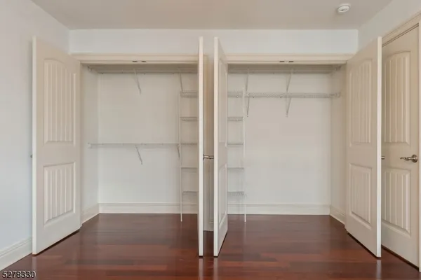 an empty room with wooden floor