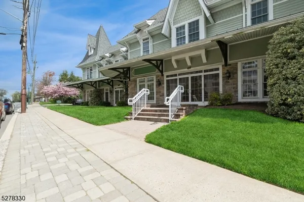 a front view of a building with garden