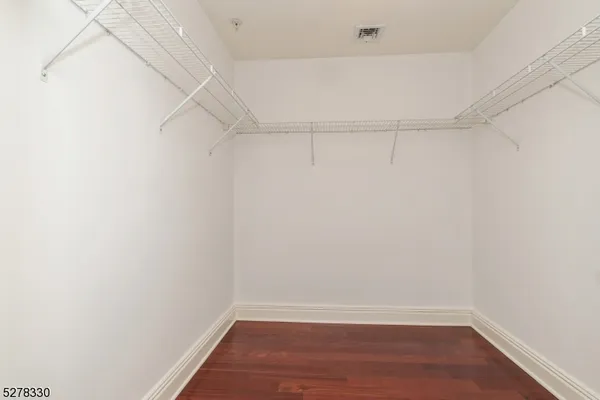 a view of an empty walk in closet