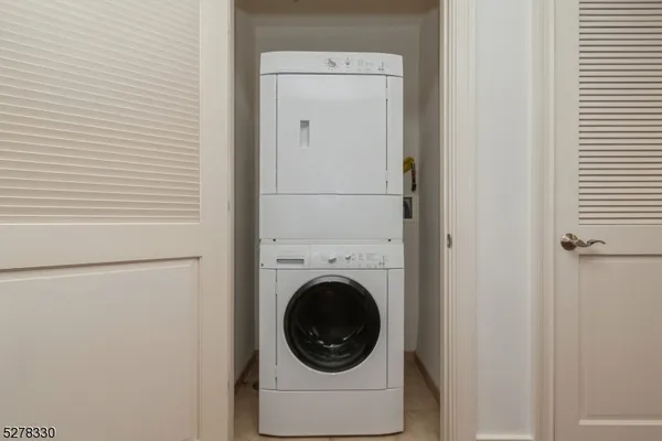 a close view of a utility room with dryer and washer