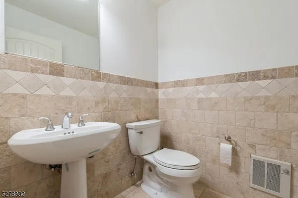 a bathroom with a sink and toilet