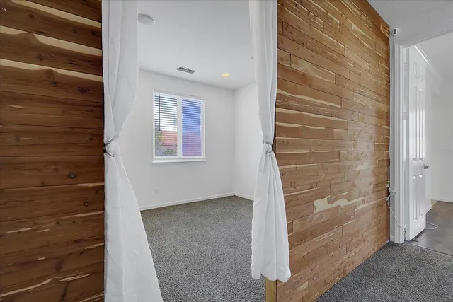 a bathroom with a granite countertop sink a shower and a mirror