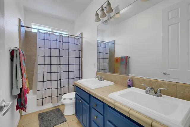 a view of a livingroom with workspace and a window