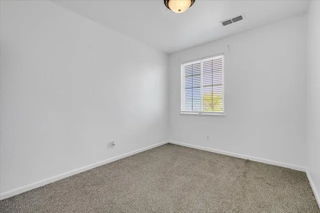 a view of a backyard of the house