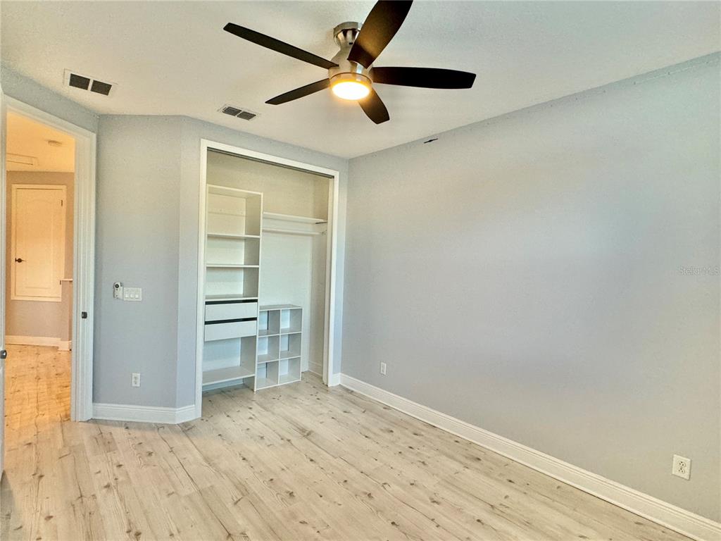 9799 Winnington Street Orlando, FL 32832 - Photo 23 of 78 wooden floor in an empty room
