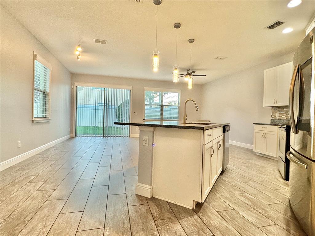 9799 Winnington Street Orlando, FL 32832 - Photo 29 of 78 a bathroom with a sink a mirror and a shower