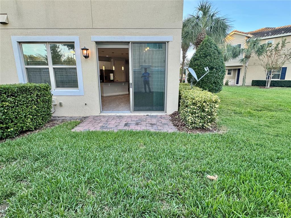 9799 Winnington Street Orlando, FL 32832 - Photo 33 of 78 front view of a house with a yard