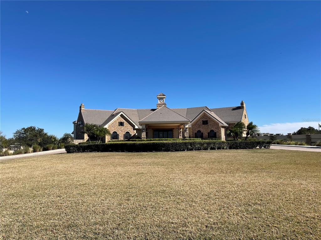 9799 Winnington Street Orlando, FL 32832 - Photo 40 of 78 a front view of a house with a yard
