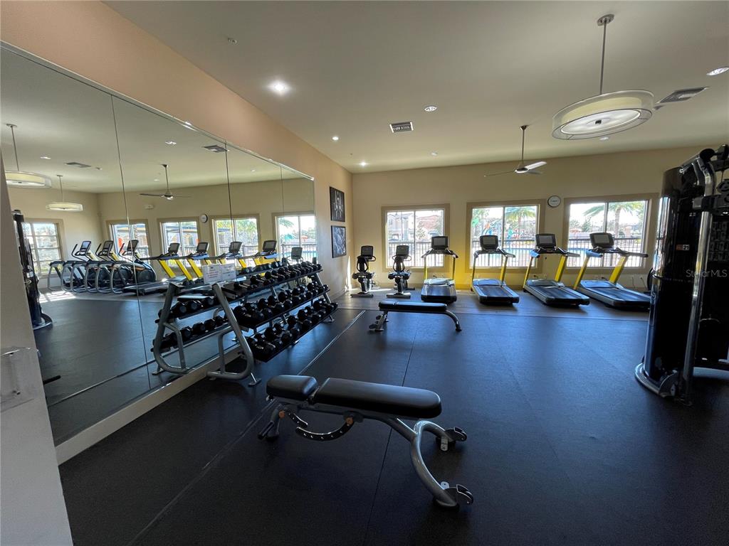 9799 Winnington Street Orlando, FL 32832 - Photo 60 of 78 a view of a room with gym equipment