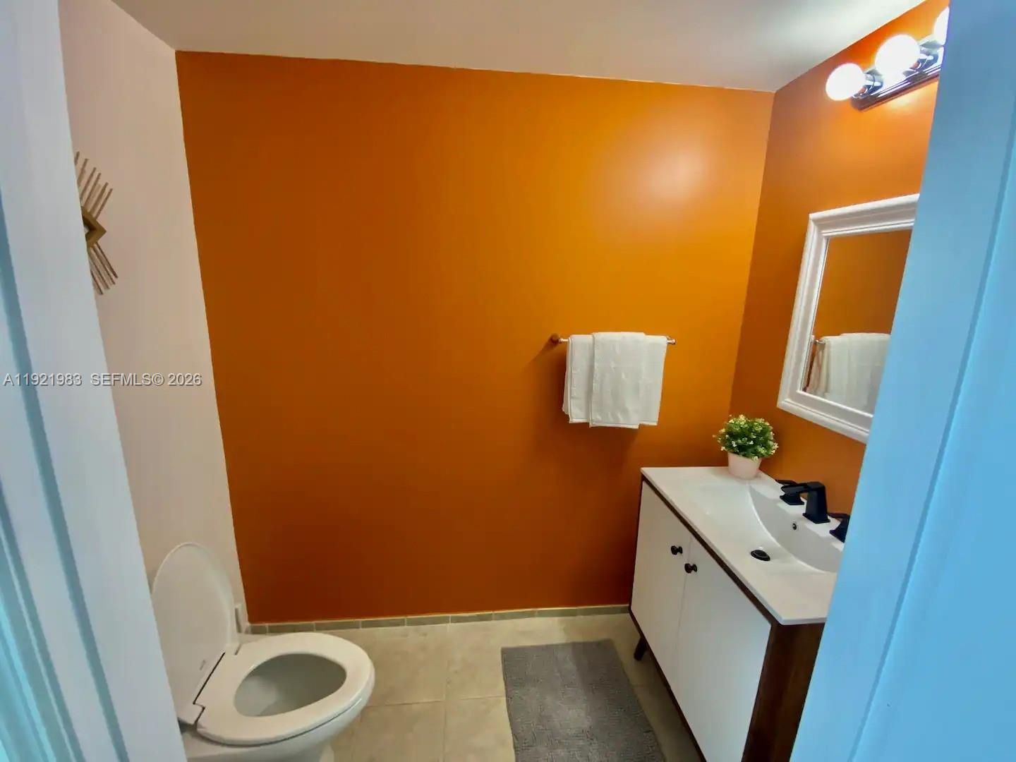 60 Southwest 13th Street, Unit 4414 Miami, FL 33130 - Photo 14 of 21 a bathroom with a sink and toilet