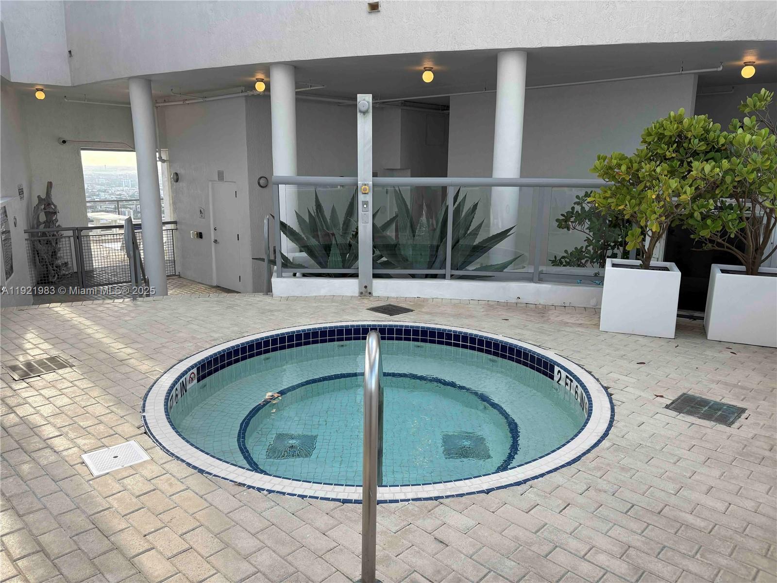 60 Southwest 13th Street, Unit 4414 Miami, FL 33130 - Photo 18 of 22 a view of a indoor swimming pool