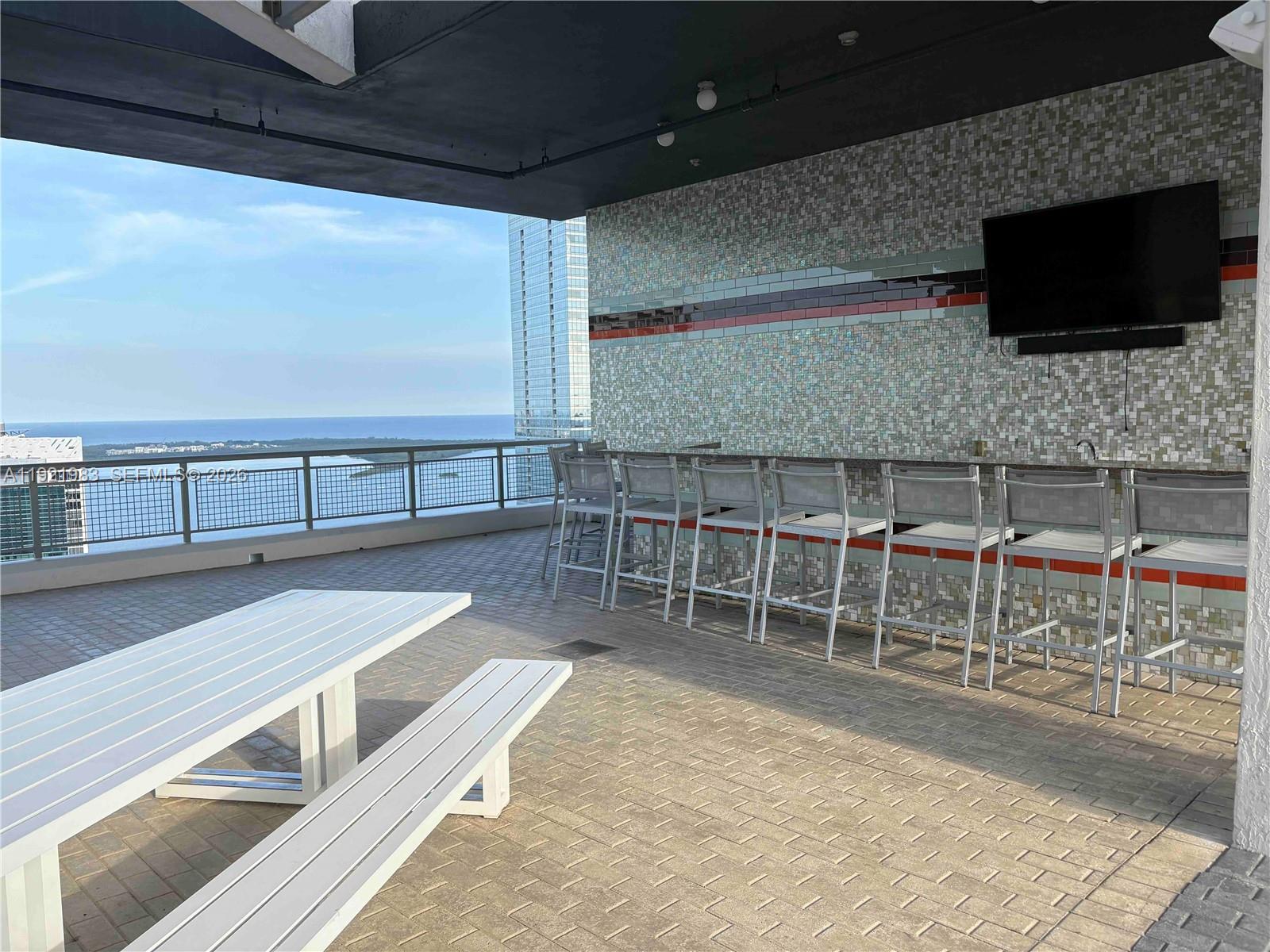 60 Southwest 13th Street, Unit 4414 Miami, FL 33130 - Photo 20 of 21 a view of a kitchen with furniture