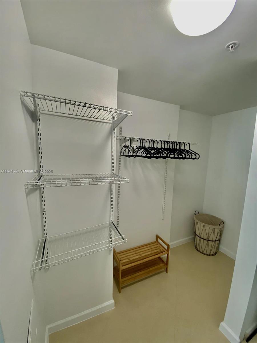 60 Southwest 13th Street, Unit 4414 Miami, FL 33130 - Photo 6 of 22 a bathroom with a shower