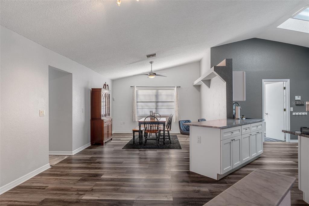 10918 Midland Bridge Road Hudson, FL 34667 - Photo 17 of 42 a kitchen with stainless steel appliances granite countertop a stove and cabinets