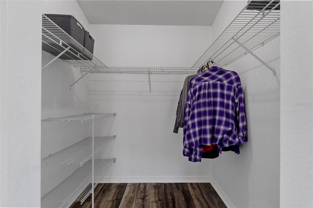 10918 Midland Bridge Road Hudson, FL 34667 - Photo 20 of 42 a view of walk in closet with empty racks